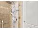 This tiled shower features a shower head and a handheld shower wand at 3370 Cascina Cir # D, Highlands Ranch, CO 80126