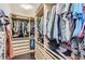 This walk-in closet boasts ample hanging space and storage shelves at 3370 Cascina Cir # D, Highlands Ranch, CO 80126