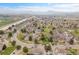 Scenic aerial view of a residential community with mountain views and landscaped lawns at 3355 S Flower St # 131, Lakewood, CO 80227