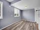 Cozy dining area with a window, neutral paint, and wood-look laminate flooring at 3355 S Flower St # 131, Lakewood, CO 80227