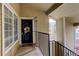 Welcoming front patio with a decorated door and railing, adding curb appeal at 8422 S Upham Way # H75, Littleton, CO 80128