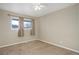 Bedroom with natural light from two windows and neutral walls at 8487 Everett Way # E, Arvada, CO 80005