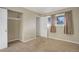 Cozy bedroom with an open closet, windows, and neutral paint at 8487 Everett Way # E, Arvada, CO 80005