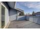 A private deck with a wood fence and wooden planks for outdoor enjoyment at 8487 Everett Way # E, Arvada, CO 80005
