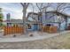 Townhome's exterior with natural landscape and a sidewalk at 8487 Everett Way # E, Arvada, CO 80005