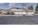 Townhome with attached garages and parking lot at 8487 Everett Way # E, Arvada, CO 80005