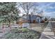 Inviting blue townhomes community named 'The Oaks' with mature landscaping at 8487 Everett Way # E, Arvada, CO 80005