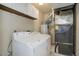 Laundry room with a washer, dryer, and utility features at 8487 Everett Way # E, Arvada, CO 80005