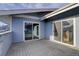 Private outdoor patio with sliding glass doors at 8487 Everett Way # E, Arvada, CO 80005