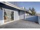 Outdoor patio with sliding glass door access to the home at 8487 Everett Way # E, Arvada, CO 80005