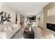 Open-concept living space flowing into a gourmet kitchen and dining area, filled with natural light at 4570 N Raleigh St, Denver, CO 80212