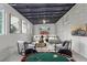 Staged basement featuring neutral furnishings, sleek ceilings, and entertainment space at 5174 Dudley St, Arvada, CO 80002