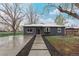 Charming home featuring a walkway to the front door and a beautifully painted exterior at 5174 Dudley St, Arvada, CO 80002