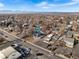 Aerial view of the property with mountain views at 6145 W 38Th Ave, Wheat Ridge, CO 80033