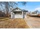 Brick house with front porch and driveway, offering curb appeal at 6145 W 38Th Ave, Wheat Ridge, CO 80033