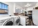 Convenient laundry room with side-by-side washer and dryer at 6145 W 38Th Ave, Wheat Ridge, CO 80033