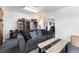 Cozy living room with grey couch and built-in shelves at 6145 W 38Th Ave, Wheat Ridge, CO 80033