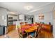 Bright dining area with wood table and chairs, adjacent to kitchen at 7114 E Briarwood Dr, Centennial, CO 80112