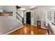 Bright entryway with hardwood floors, staircase, and coat rack at 7114 E Briarwood Dr, Centennial, CO 80112