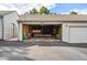 Unfinished garage with shelving and space for storage at 7114 E Briarwood Dr, Centennial, CO 80112