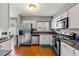 Modern kitchen featuring stainless steel appliances and granite countertops at 7114 E Briarwood Dr, Centennial, CO 80112