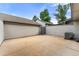 Private patio with concrete flooring and AC unit at 7114 E Briarwood Dr, Centennial, CO 80112