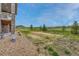Spacious backyard features an outdoor seating, an area to enjoy views and an expanse of grassy area for recreation at 9727 Red Primrose St, Franktown, CO 80116
