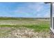 Spacious backyard with well-maintained lawn, offering ample space for outdoor activities, and open views at 9727 Red Primrose St, Franktown, CO 80116