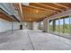 Unfinished basement with open layout, walkout access, and rough-in plumbing provides a canvas for a buyer's custom design at 9727 Red Primrose St, Franktown, CO 80116