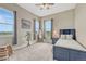 Cozy bedroom with three windows and neutral decor at 9727 Red Primrose St, Franktown, CO 80116