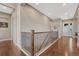 Spacious foyer with hardwood floors, staircase, and a stylish front door with decorative glass at 9727 Red Primrose St, Franktown, CO 80116
