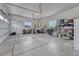 Spacious three car garage with ample storage space for vehicles and equipment, painted with neutral white at 9727 Red Primrose St, Franktown, CO 80116