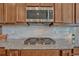 Well-equipped kitchen showcasing granite counters, stainless steel appliances, and custom cabinetry at 9727 Red Primrose St, Franktown, CO 80116