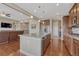 Open concept kitchen flows into the living area, boasting granite counters and stainless appliances at 9727 Red Primrose St, Franktown, CO 80116