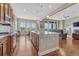 Bright kitchen with a large island, stainless steel appliances, and an adjacent breakfast nook at 9727 Red Primrose St, Franktown, CO 80116