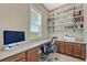 Functional home office features built-in shelving and desk area at 9727 Red Primrose St, Franktown, CO 80116