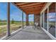 Outdoor patio featuring stone pillars and covered area, perfect for enjoying serene views and al fresco dining at 9727 Red Primrose St, Franktown, CO 80116