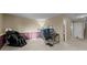 Large bonus room offers flexible layout possibilities with plush carpet, and a nearby staircase at 17613 E Ohio Cir, Aurora, CO 80017