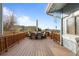 Outdoor deck featuring patio furniture, overlooking the cityscape with natural sunlight at 17613 E Ohio Cir, Aurora, CO 80017