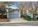 Charming single-Gathering home showcasing a well-kept lawn, driveway, and attached two-car garage at 17613 E Ohio Cir, Aurora, CO 80017