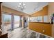 Bright open concept kitchen with stainless steel appliances and access to a deck at 17613 E Ohio Cir, Aurora, CO 80017