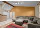 Spacious living room with high ceilings, comfortable sofa, and warm lighting at 17613 E Ohio Cir, Aurora, CO 80017