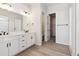 Modern bathroom with double vanity, large mirror, and separate shower at 4704 Twelve Oaks Way, Castle Rock, CO 80104