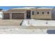 Two-story house with light beige siding, stone accents, and a two-car garage at 4704 Twelve Oaks Way, Castle Rock, CO 80104