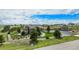 Expansive home featuring a well-maintained lawn, bordered by lush trees and rock features at 555 Heritage Trl, Elizabeth, CO 80107