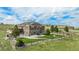 Beautiful backyard features a well-maintained lawn, a fenced-in yard and a patio with outdoor seating area at 555 Heritage Trl, Elizabeth, CO 80107