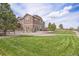 Well-maintained backyard with lush green grass and a beautiful landscape at 555 Heritage Trl, Elizabeth, CO 80107