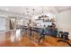 Entertainment bar area with a large granite countertop, seating for six, open shelving, and custom decor elements at 555 Heritage Trl, Elizabeth, CO 80107