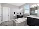 Contemporary bathroom with a soaking tub, double vanity, and tiled shower at 555 Heritage Trl, Elizabeth, CO 80107