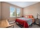 Comfortable bedroom with two windows, warm tones, and stylish bedding at 555 Heritage Trl, Elizabeth, CO 80107